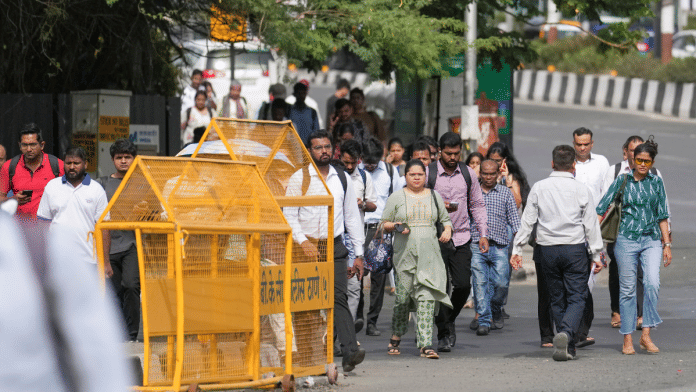 Commuters walk through Bandra-Kurla Complex (BKC) during the 'Weekly Public Transport Day' campaign in Mumbai on Friday | PTI