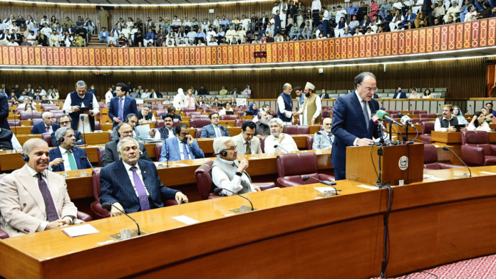 Pakistan Finance Minister Muhammad Aurangzeb (standing) delivers the budget speech during the Budget Session 2026–27 of the National Assembly | X/@NAofPakistan