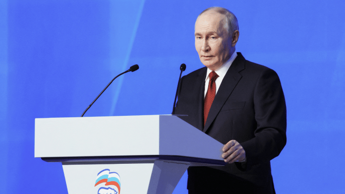 Russia's Vladimir Putin addresses the audience at the 23rd Congress of the United Russia party in Moscow, in this pool photo supplied by Russian state media, on June 28. | Photographer Yekaterina Shtukina | Bloomberg