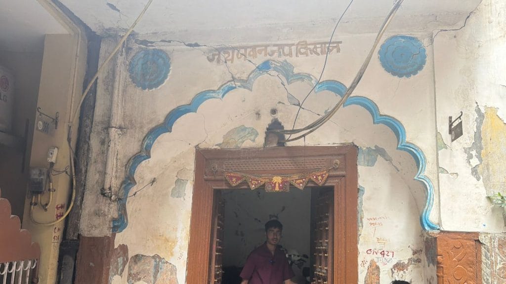 An old doorway stands as a reminder of Shahpur Jat’s village past amid its rapidly changing landscape | Triya Gulati, ThePrint