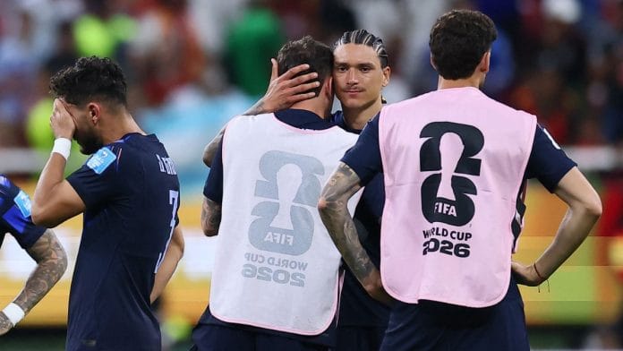 Darwin Nunez of Uruguay looks dejected with teammates after the match against Spain in the FIFA World Cup | Eloisa Sanchez | Reuters