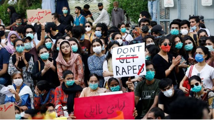 People carry signs to condemn violence against women and girls, during a protest in Karachi, Pakistan, 12 September, 2020 | REUTERS/Akhtar Soomro/File Photo