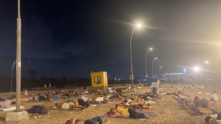 Mumbai heat has turned Versova beach into a bedroom. Who is sleeping there?