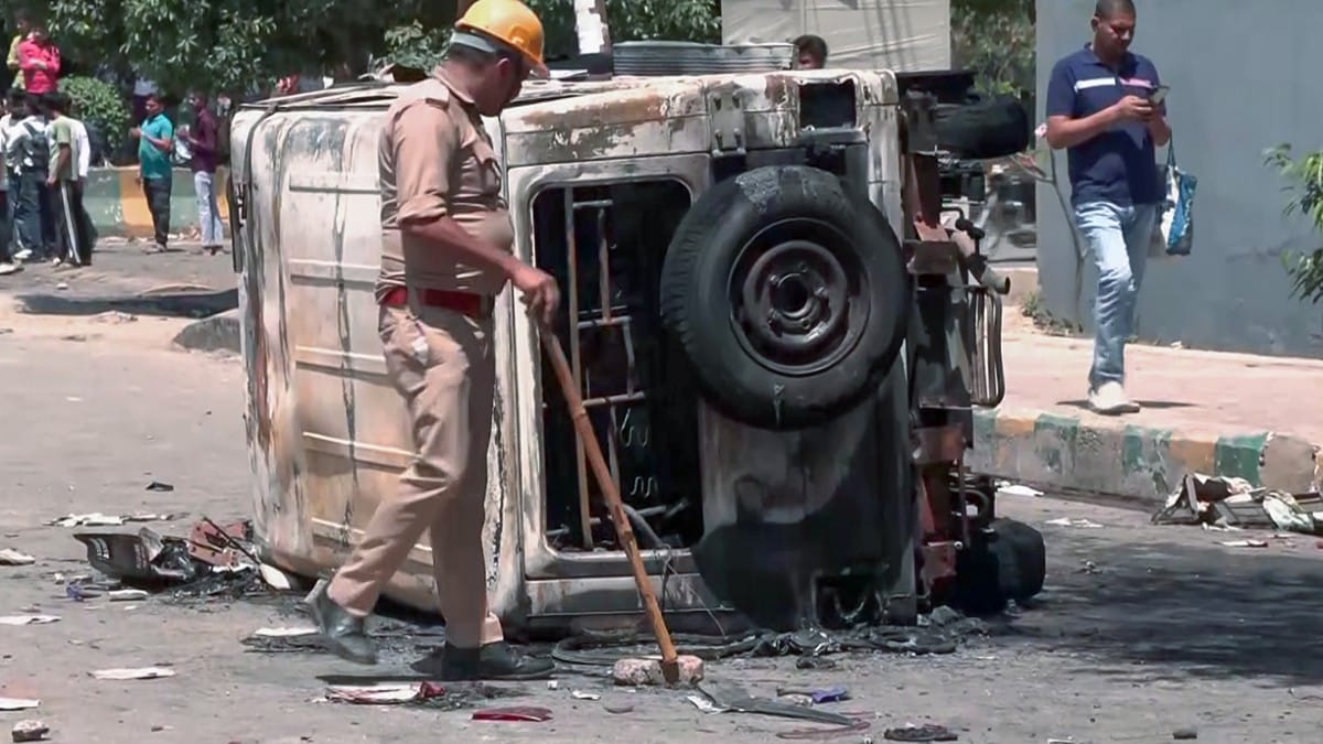 Police vehicles vandalised during workers' protest in Noida on 13 April 2026 | Sumit/ANI