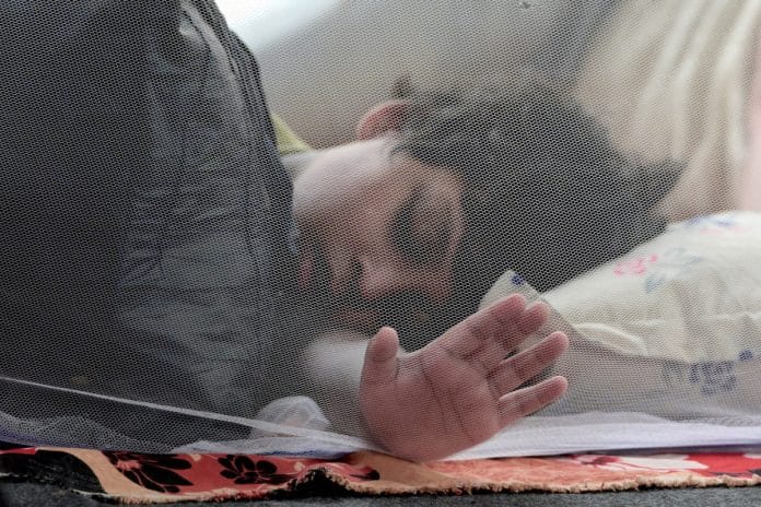 A child is sleeping inside mosquito net during a ongoing protest at Jantar Mantar | Photo: Suraj Singh Bisht | ThePrint