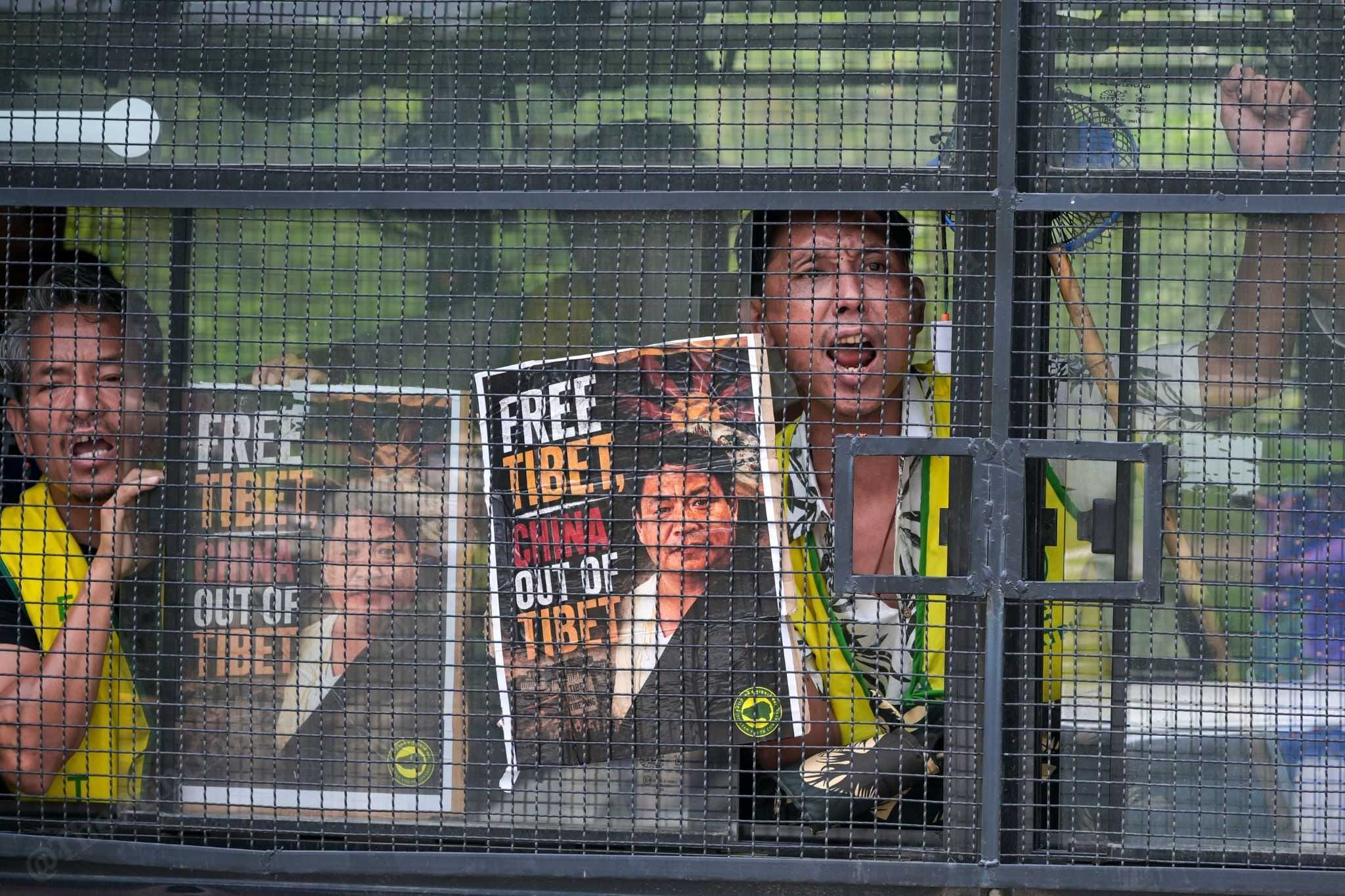Protesting members of the Tibetan Youth Congress in a police bus after being detained | Suraj Singh Bisht