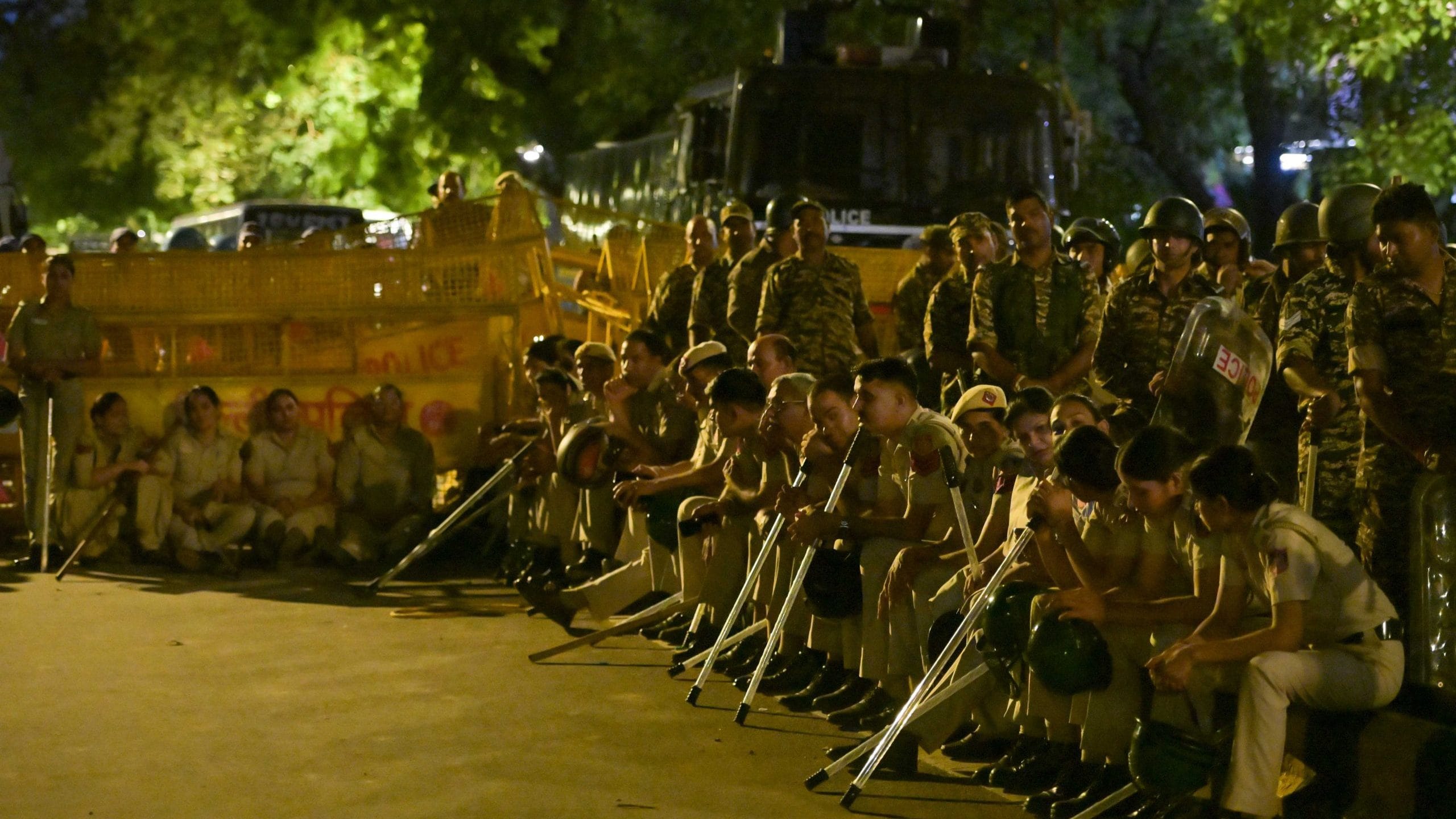 Night visuals from cockroach Janata party protest. People gather near sansad marg shouting slogans demanding Education Minister Dharmendra Pradhan's resignation. | Suraj Singh Bisht| Theprint