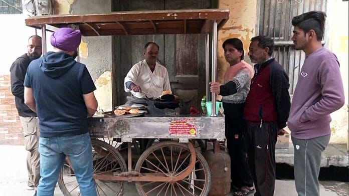A street food vendor prepares food as the markets open in Sambhal following the stone pelting incident which took place when a team arrived to survey Shahi Jama Masjid on 24th November, on Tuesday. | ANI Photo