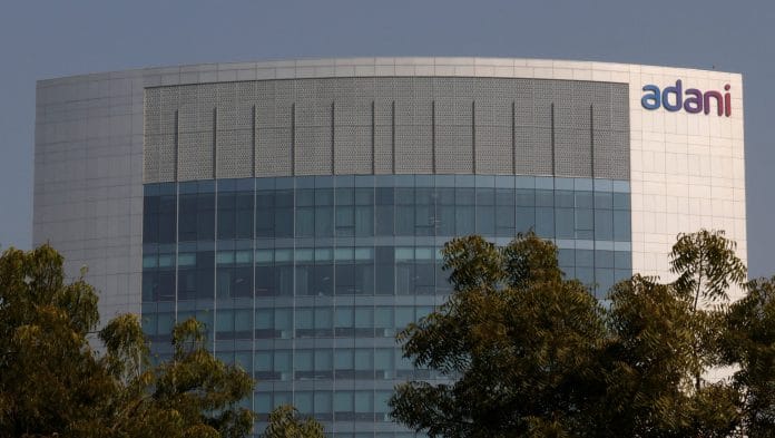 The logo of the Adani Group is seen on the facade of its Corporate House on the outskirts of Ahmedabad, India Amit Dave | REUTERS