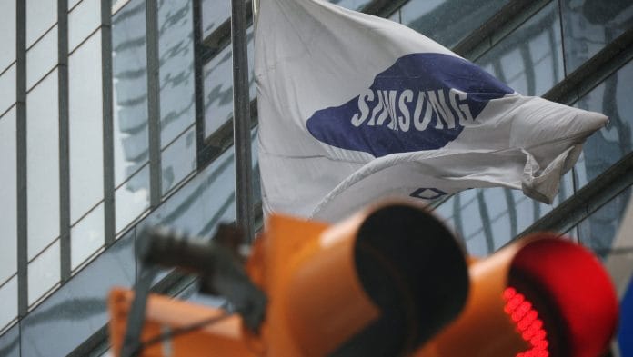 A flag bearing the logo of Samsung Electronics flutters as it rains in front of their office building in Seoul, South Korea Kim Hong-Ji | REUTERS