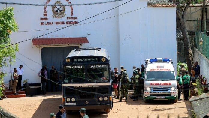 Prisoners board a bus to be transferred to another prison following clashes between two groups of inmates at Negombo Prison, in the coastal town of Negombo, Sri Lanka Lahiru Harshana | REUTERS