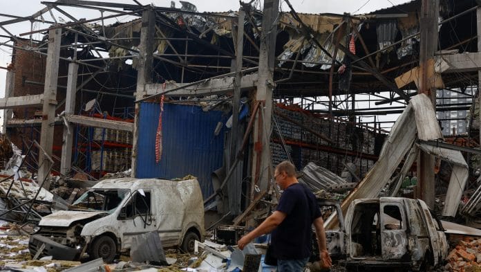 An employee walks at the site of food and drink warehouses hit by an overnight Russian missile strike, amid Russia’s attack on Ukraine, in Kyiv, Ukraine REUTERS/Valentyn Ogirenko