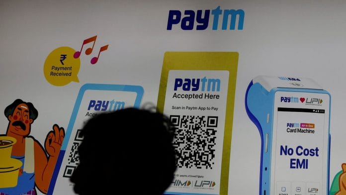 A man stands at the Paytm stall during the Global Fintech Fest in Mumbai, India | Francis Mascarenhas/Reuters