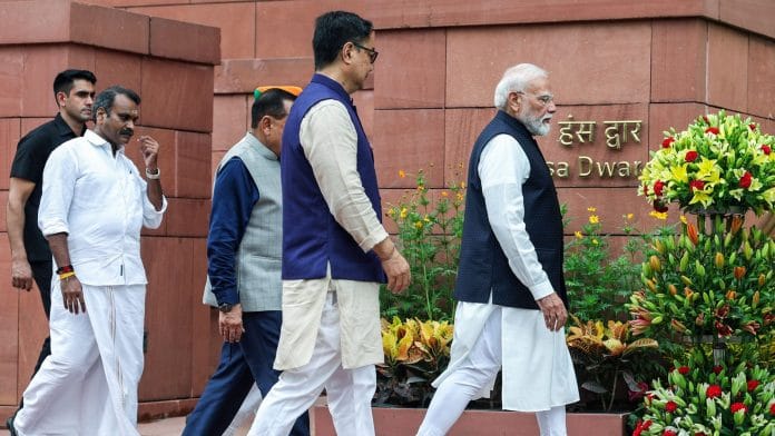 New Delhi, Jul 20 (ANI): Prime Minister Narendra Modi, Union Minister of Parliamentary Affairs Kiren Rijiju, and MoS L. Murugan at Parliament premises on the first day of the Monsoon Session, in New Delhi on Monday. (DPR PMO/ANI Photo)