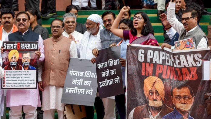 BJP MPs stage a protest outside Parliament demanding the resignation of Punjab Education Minister Harjot Singh Bains over the alleged paper leak in the state, in New Delhi. | Rahul Singh/ ANI