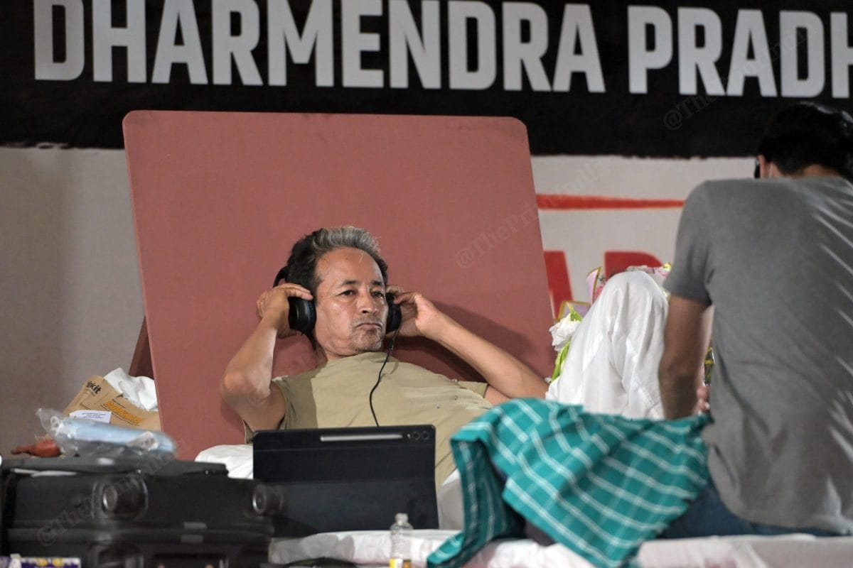 Activist Sonam Wangchuk is listening on his headphone | Photo: Suraj Singh Bisht | ThePrint