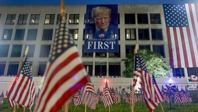 A banner of US. President Donald Trump, hanging from the U.S. Department of Labor building, ahead of July 4th festivities | Bloomberg