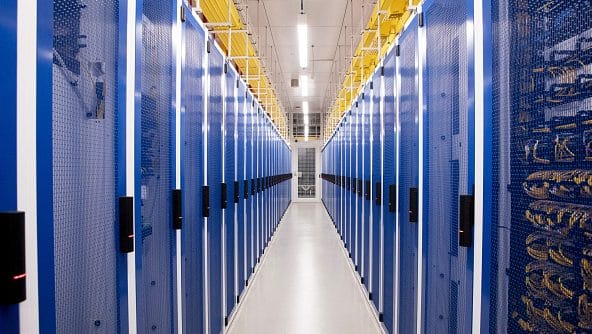Cabinets housing servers inside a data hall at a NextDC Ltd. data center in Sydney, Australia, on Monday, Dec. 8, 2025. OpenAI partnered with Australian data center operator NextDC to build a A$7 billion ($4.6 billion) large-scale computing cluster in Sydney, accelerating its expansion in the Asia-Pacific region | Bloomberg