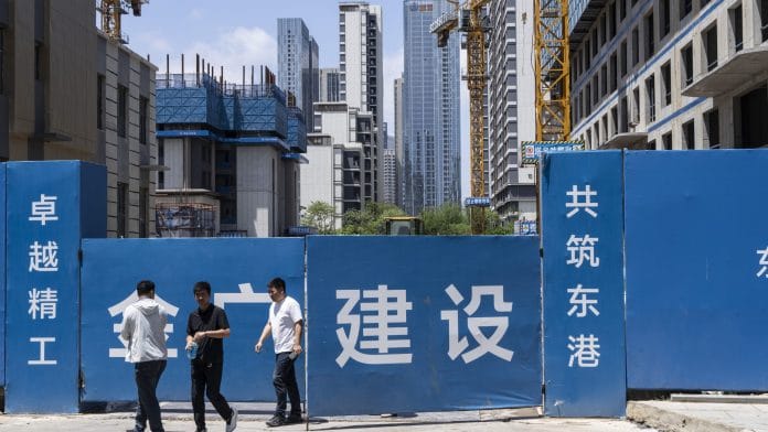 A construction site in the Donggang business district in Dalian, China, on Thursday, June 25, 2026. A growing number of Chinese economists are forecasting the country will keep its policy interest rate unchanged throughout 2026, though an adviser to the central bank said such a move still remains a possibility. | Bloomberg