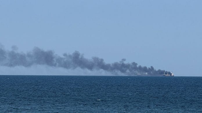 Smoke rises from a civilian vessel on fire, amid Russia's attack on Ukraine, in Odessa, on 19 July 2026 | Stringer/Reuters