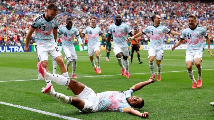 Youri Tielemans of Belgium celebrates after scoring their third goal against Senegal in the 2026 FIFA World Cup early Thursday | Agustin Marcarian | Reuters
