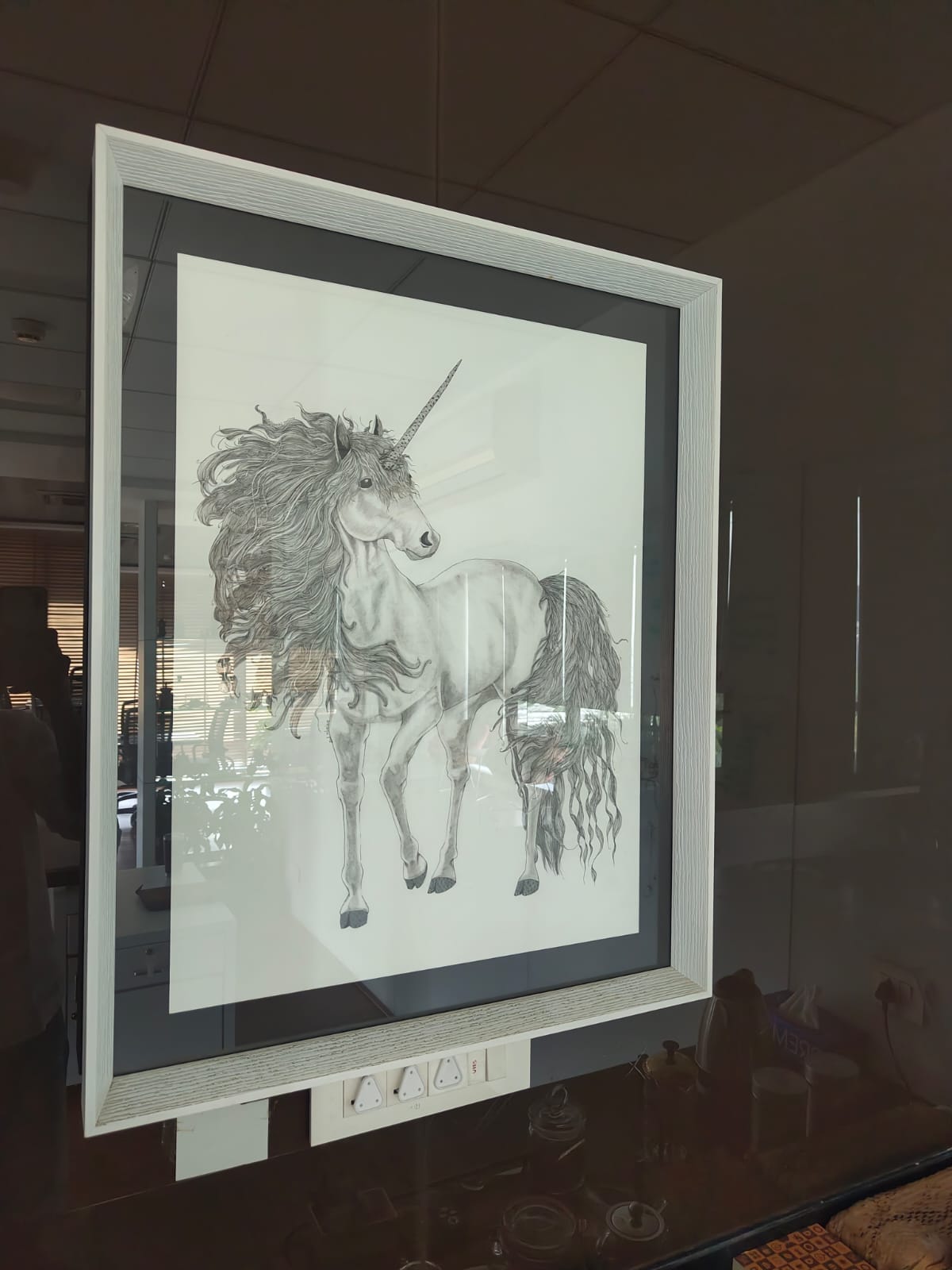 A portrait of a unicorn hanging in Hari's office to remind him of his goal of making CallHealth the next unicorn | By special arrangement
