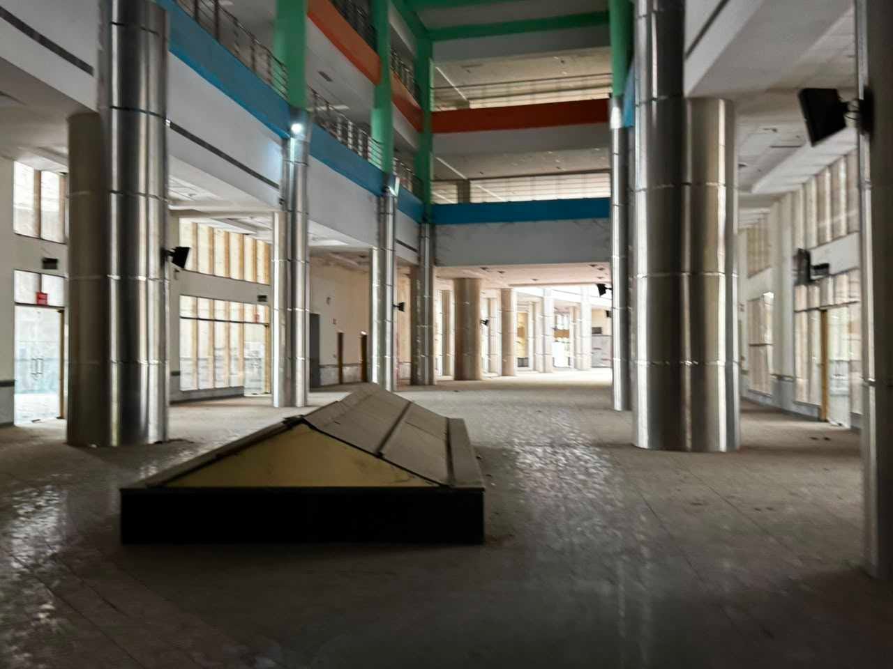 Inside, the empty eight-storey structure is draped in cobwebs, with peeling walls, shuttered commercial spaces, and echoing corridors that give it the feel of a ghost town | Photo: Sagrika Kissu, ThePrint