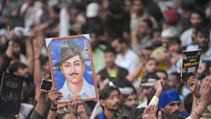 Protesting crowd seen holding up an image of revolutionary Bhagat Singh during the Cockroach Janta Party led demonstrations in New Delhi | Suraj Singh Bisht/ThePrint
