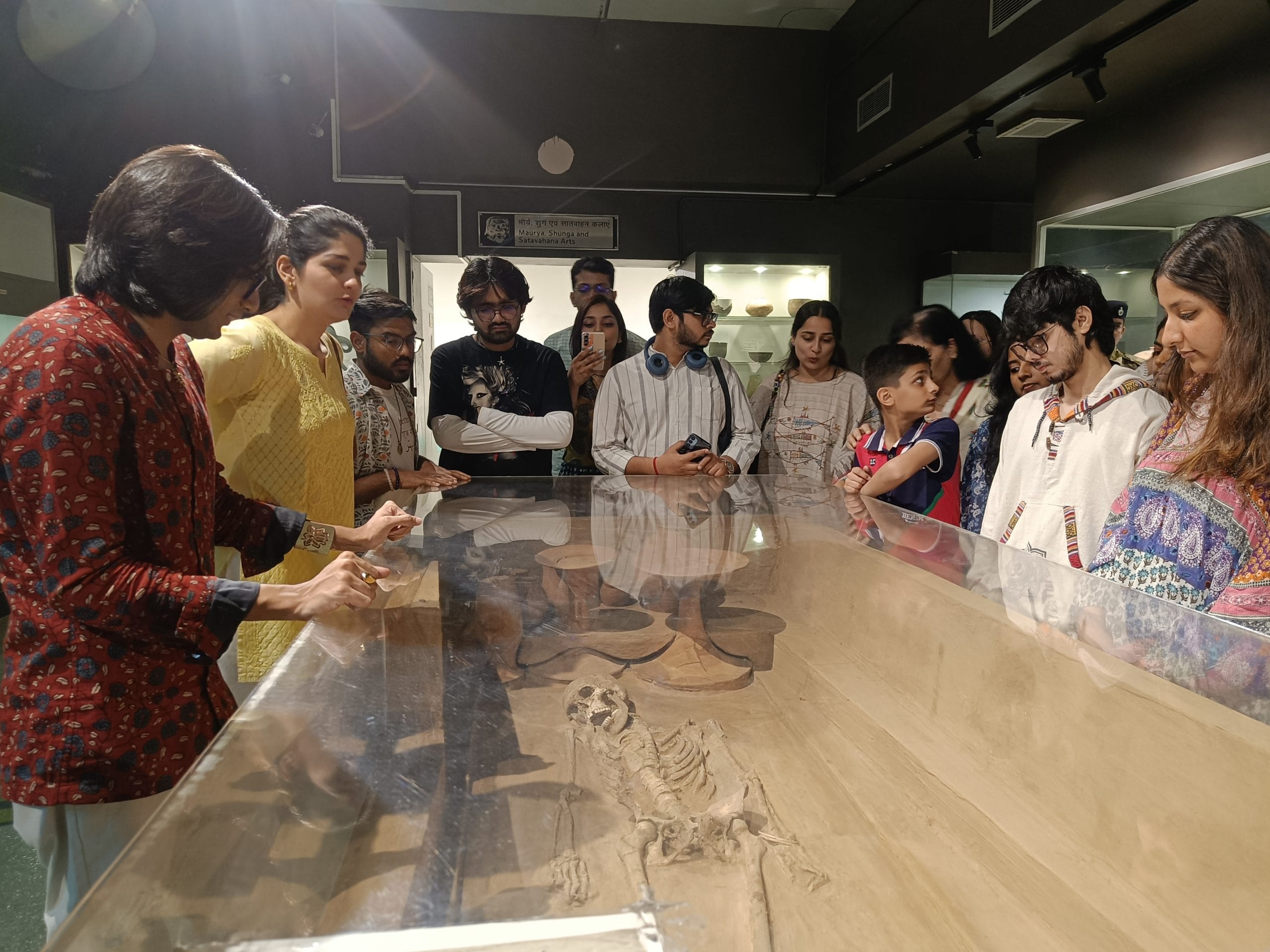 Public historian Eric Chopra (left) speaks about a woman's burial from Rakhigarhi during a museum walk | Photo: Krishan Murari/ThePrint