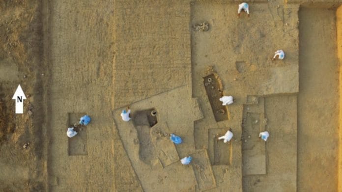 Members of archaeologist Vasant Shinde's team wear protective clothing to minimise contamination during the Rakhigarhi excavation | Photo by special arrangement