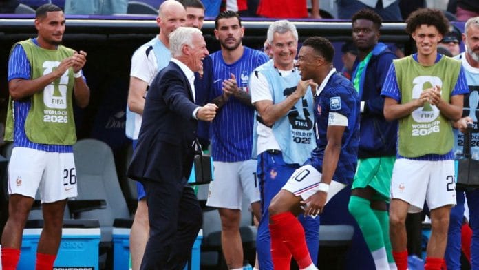 France captain Kylian Mbappe celebrates with coach Didier Deschamps after scoring a goal against Sweden in the 2026 FIFA World Cup | Mike Segar | Reuters