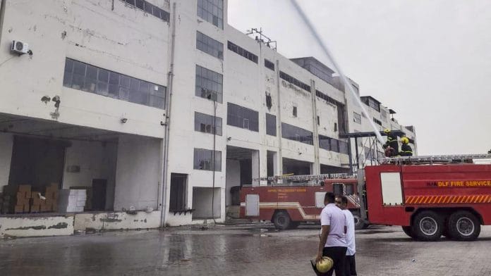 Firemen douse a fire at a warehouse at Jhund Sarai area, in Gurugram district, Haryana | PTI