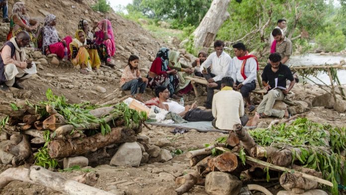 Tribals and farmers at the banks of the Barana river as the indefinite hunger strike against the Ken-Betwa Link Project and other irrigation schemes enters its 15th day, with protesters alleging inadequate rehabilitation and displacement-related grievances, in Chhatarpur district, Madhya Pradesh, Saturday, July 18, 2026. | PTI Photo
