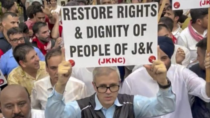 In this image, Jammu and Kashmir Chief Minister Omar Abdullah leads a protest march demanding the restoration of statehood to Jammu and Kashmir, in New Delhi. (@JKNC_/X via PTI Photo)