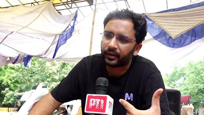 Cockroach Janta Party (CJP) Spokesperson Ashutosh Ranka speaks to PTI amid the ongoing CJP protest over the alleged NEET paper leak, at Jantar Mantar in New Delhi, Wednesday, July 22, 2026. | PTI