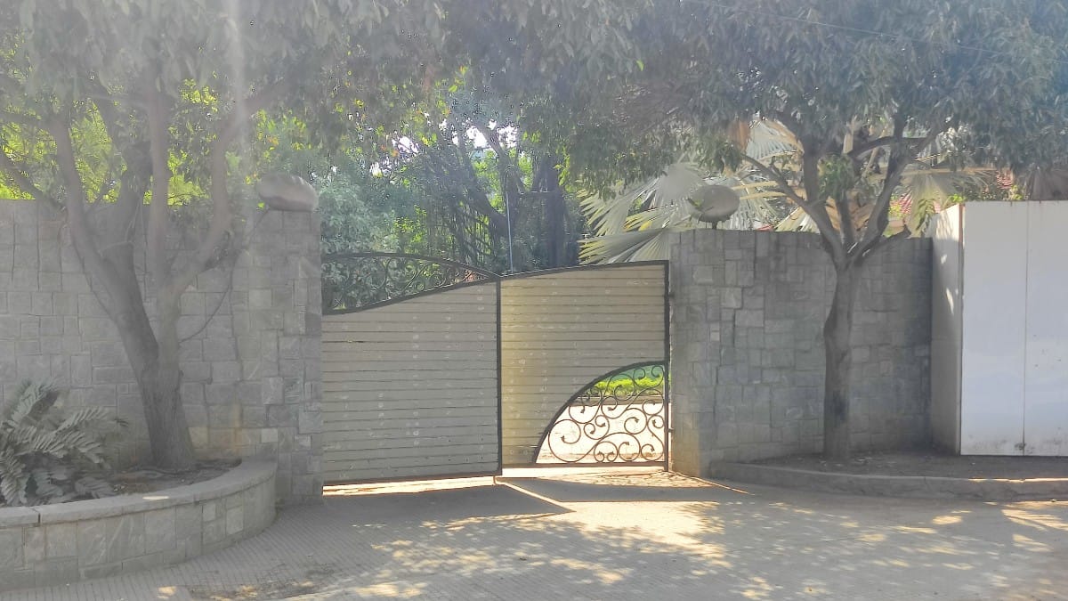 Entry gate to Raju's bungalow in Satyam Enclave battered by the elements | Amrtansh Arora/ThePrint