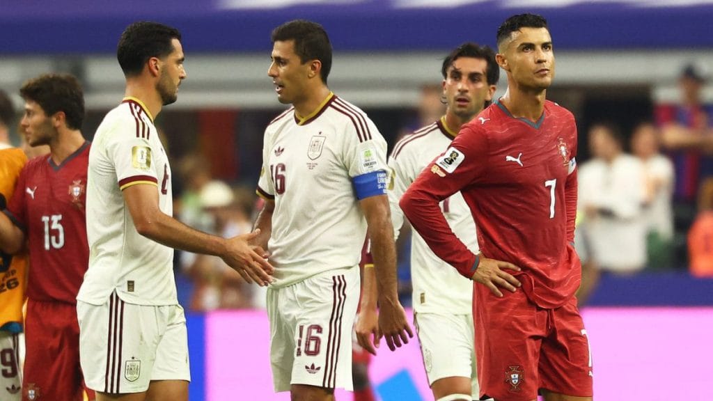 Ferran Torres, Mikel Merino and Rodri celebrate after the match as Spain qualify for the quarter finals of the World Cup. Cristiano Ronaldo looks dejected after the match as Portugal are eliminated from the tournament | Kai Pfaffenbach | Reuters