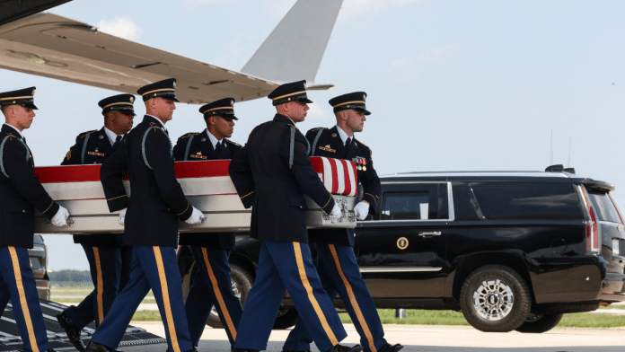 US Army personnel carry a flag-draped transfer case during an event for US service members killed during operations in Iran | Reuters File Photo