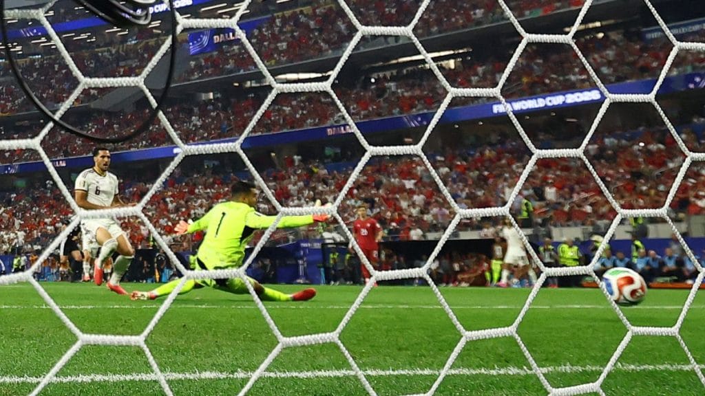 Spain's Mikel Merino scores their first goal past Portugal's Diogo Costa | Kai Pfaffenbach | Reuters