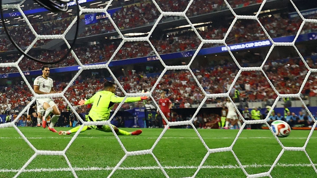 Spain's Mikel Merino scores their first goal past Portugal's Diogo Costa | Kai Pfaffenbach | Reuters