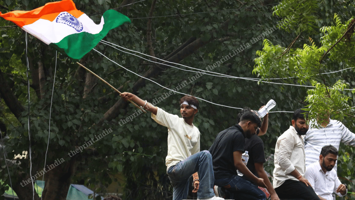 The tricolour flutters as the crowds soak in the joyous spirit at Jantar Mantar on Saturday | Praveen Jain | ThePrint