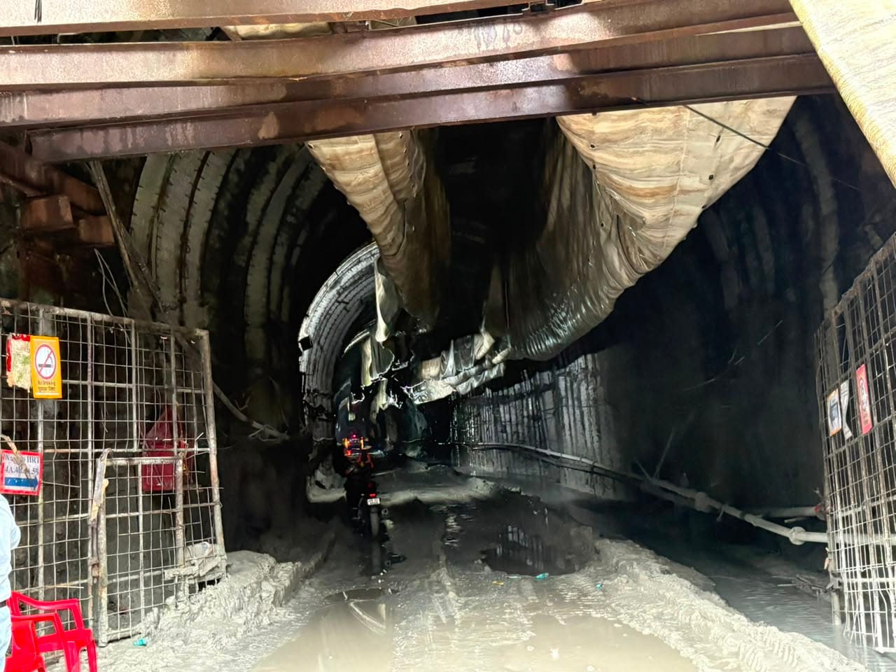 Inside the Teesta Stage VI tunnel, showing the flooded, mud-slicked passage and damaged ventilation ducting after the blast | Photo: Sakshi Mehra/ThePrint