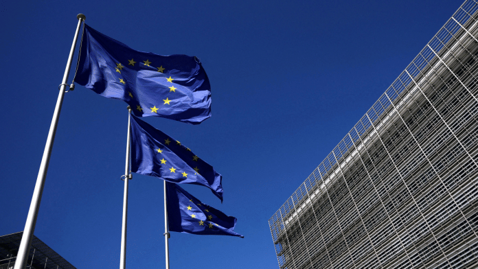 European Union flags outside the European Commission headquarters in Brussels, Belgium. | Reuters