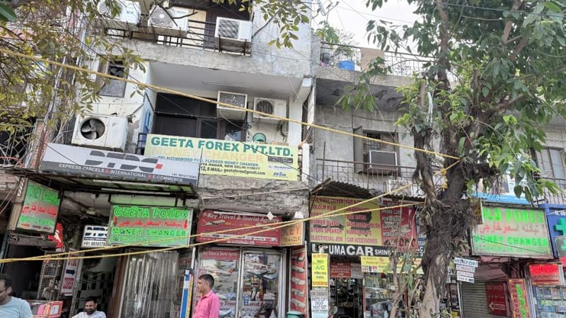The street opposite Max Hospital is littered with currency exchanges, travel agencies, with rooms above them, and all with signs in multiple foreign languages. Tarini Unnikrishnan | ThePrint