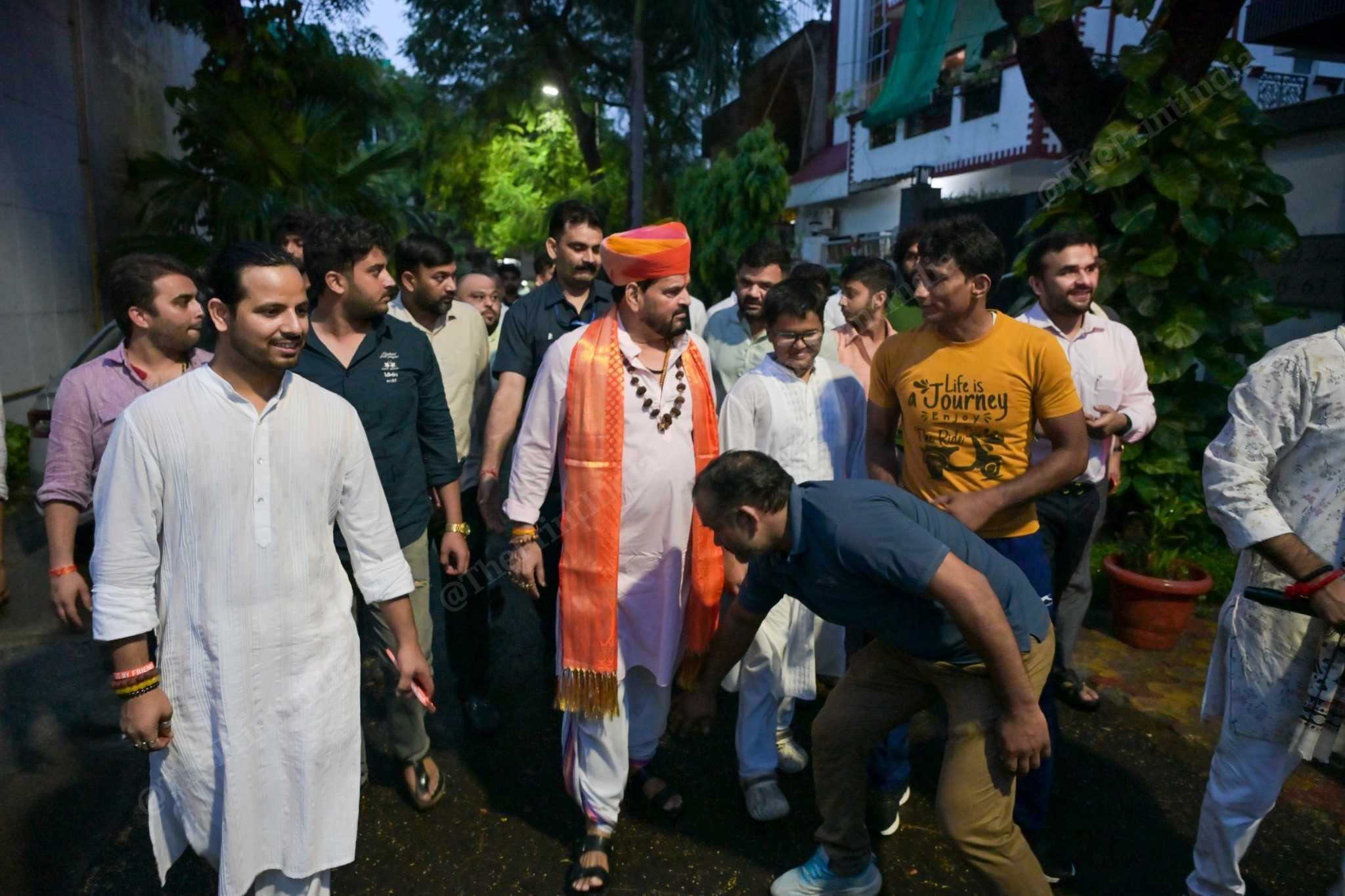 Brij Bhushan Sharan Singh welcomed by his family members and supporters in Noida, on 4 August, 2026, after getting relief from a Delhi court in a sexual harassment case involving women wrestlers | Suraj Singh Bisht/ThePrint