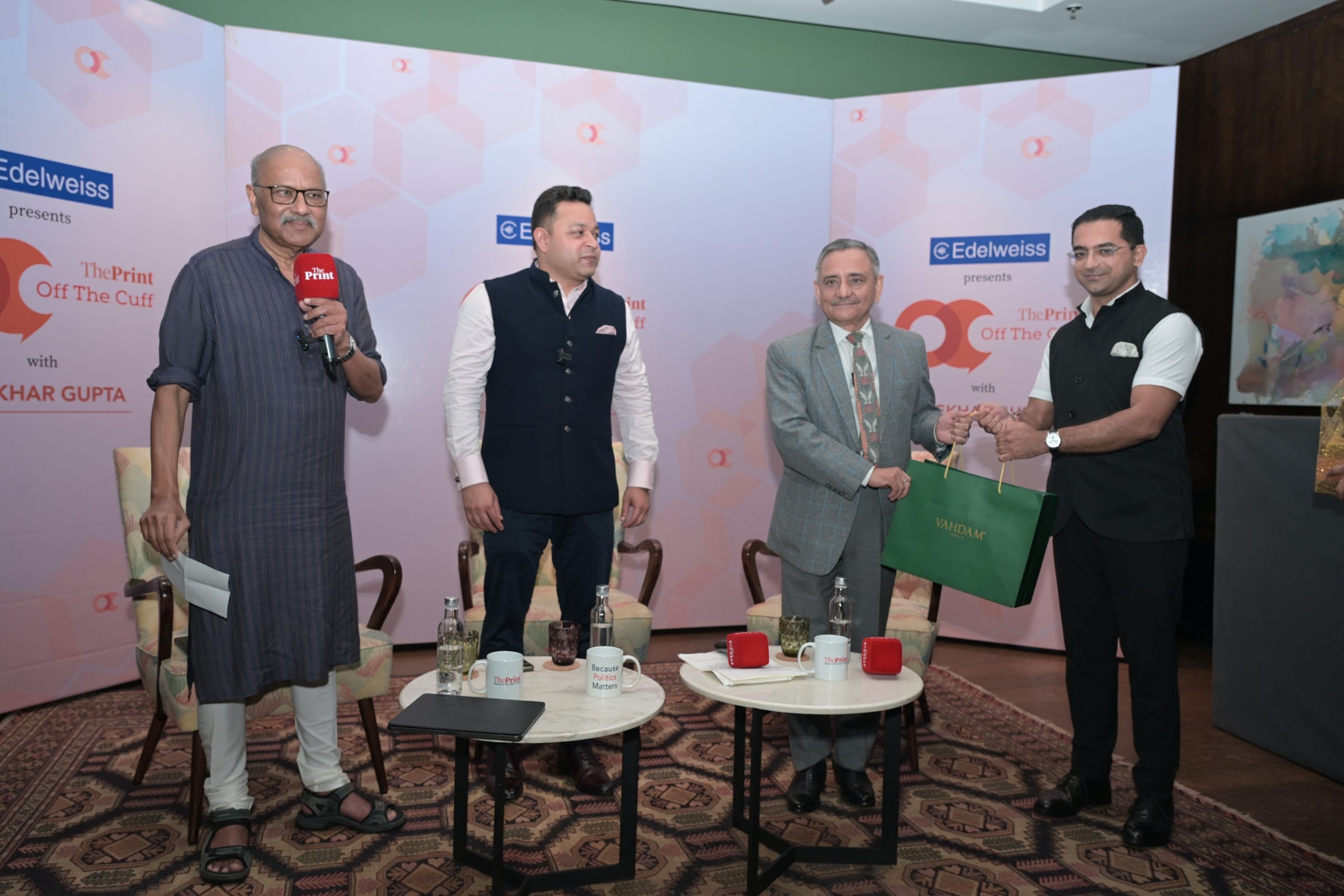 Nikhil Alung, General Manager of The Quorum, Gurugram presents a gift hamper from Vahdam India to General Anil Chauhan (Retd) | Suraj Singh Bisht/ThePrint