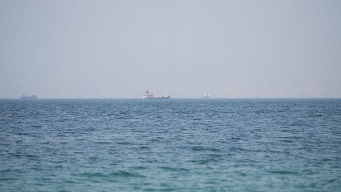 Vessels near the Strait of Hormuz, as seen from Musandam, Oman, August 6, 2026. | Stringer / REUTERS