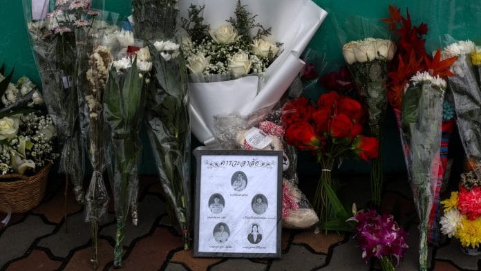 Flowers and pictures of teachers killed are left outside Debsirin Nonthaburi School following a deadly shooting at the school, in Bang Kruai district in Nonthaburi province, on the outskirts of Bangkok, Thailand, August 9, 2026.| Valeria Mongelli / REUTERS