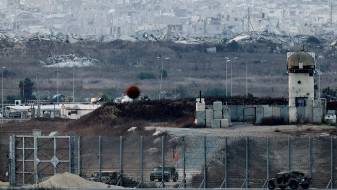Military vehicles operate on the border with Gaza, as seen from the Israeli side of the border, August 2, 2026. Amir Cohen/REUTERS
