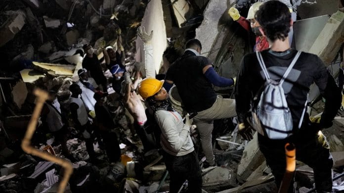 Rescuers work at the site of a collapsed building following an earthquake, in Cali, Colombia, August 10, 2026. | Sergio Acero / REUTERS
